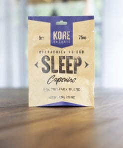 Kore Organic CBD Sleep Capsules package, containing 5 capsules with 75mg total CBD, displayed on a wooden surface