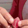 Opening a cherry gummy