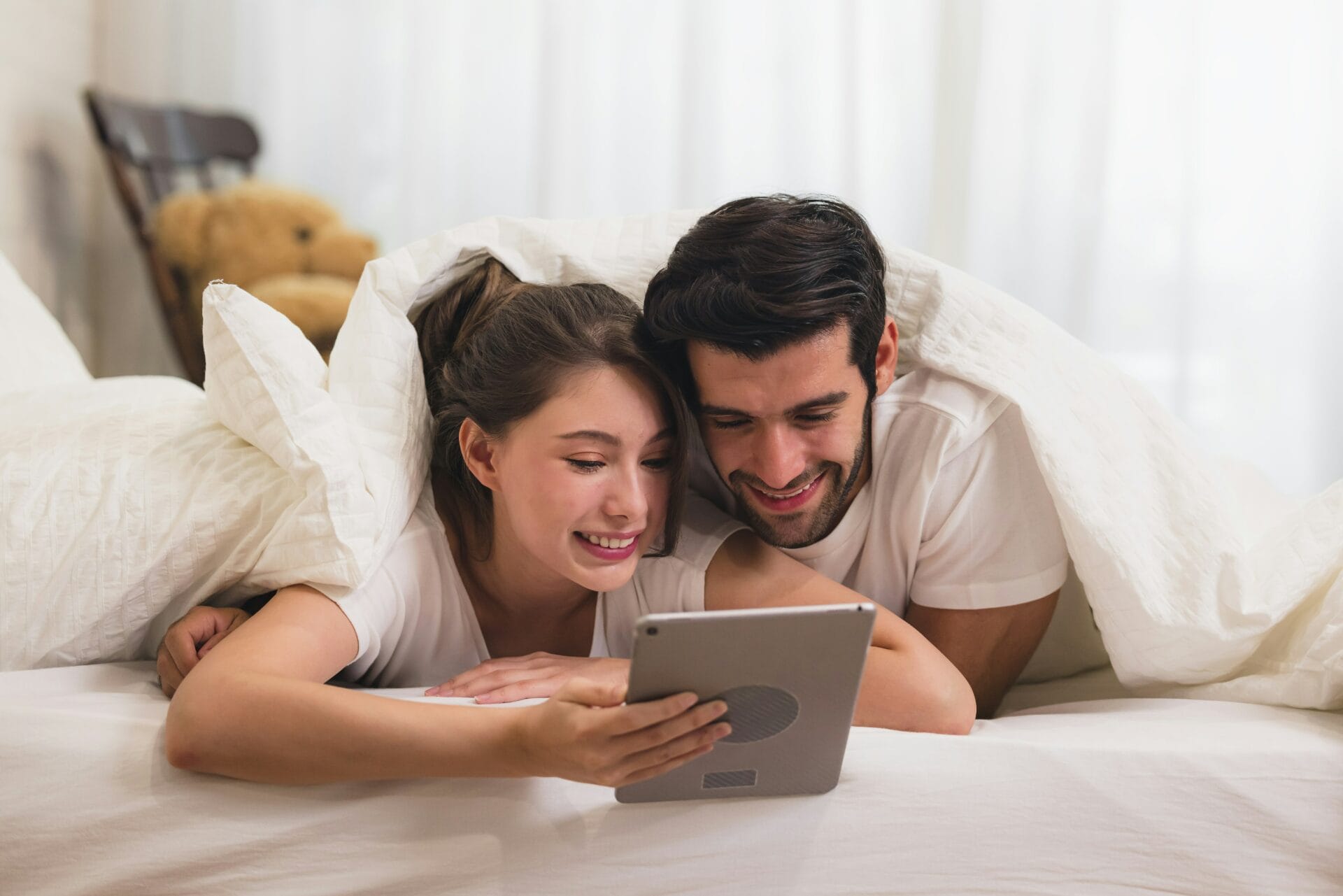 A couple watching movie on tablet