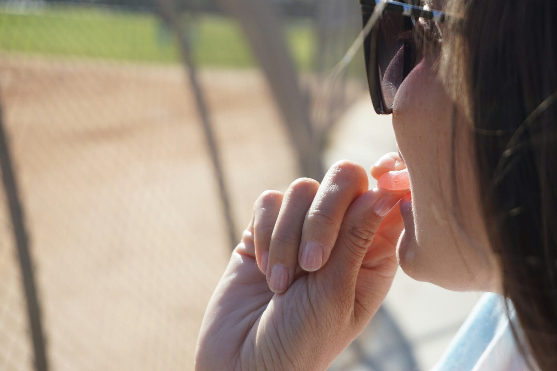 girl eating a gummy