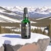 Waar botanicals full spectrum bottle in the Colorado mountains